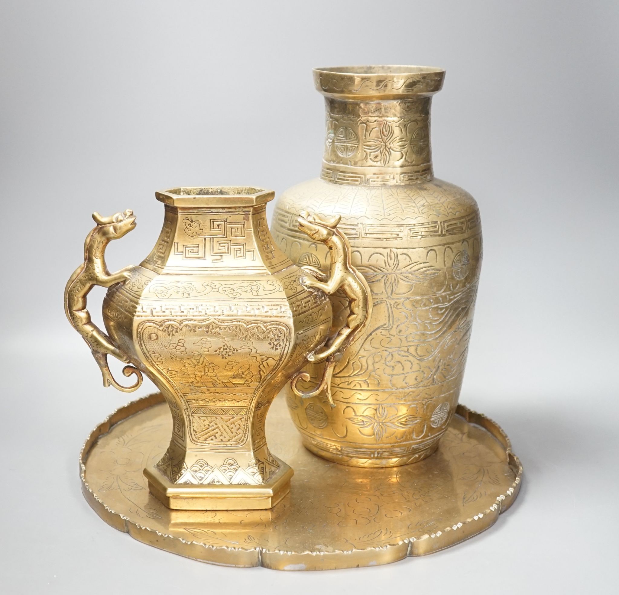 Two early 20th century Chinese bronze vases and tray, 35cm diam.